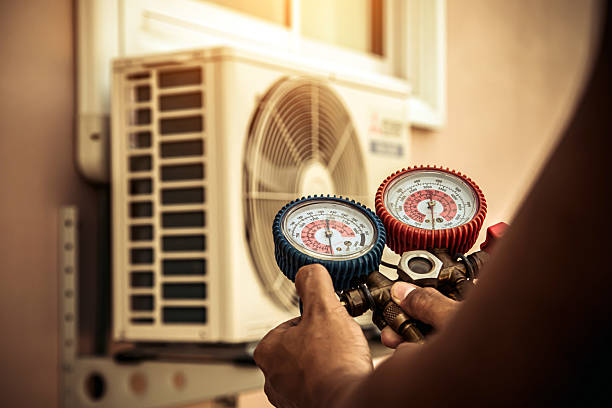 Professional Air Conditioning Service technician working in Seneca, MO